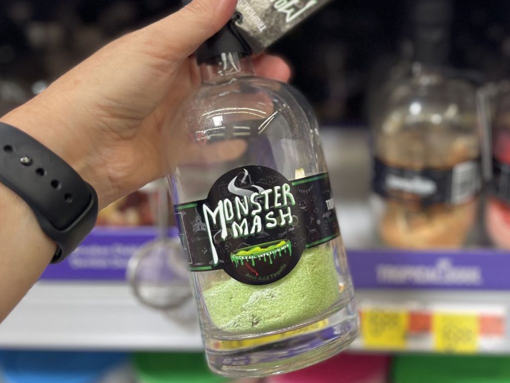 hand holding a Monster Mash bottle