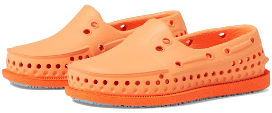 A pair of orange Native kids shoes