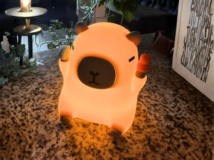 Capybara bedtime night light on table