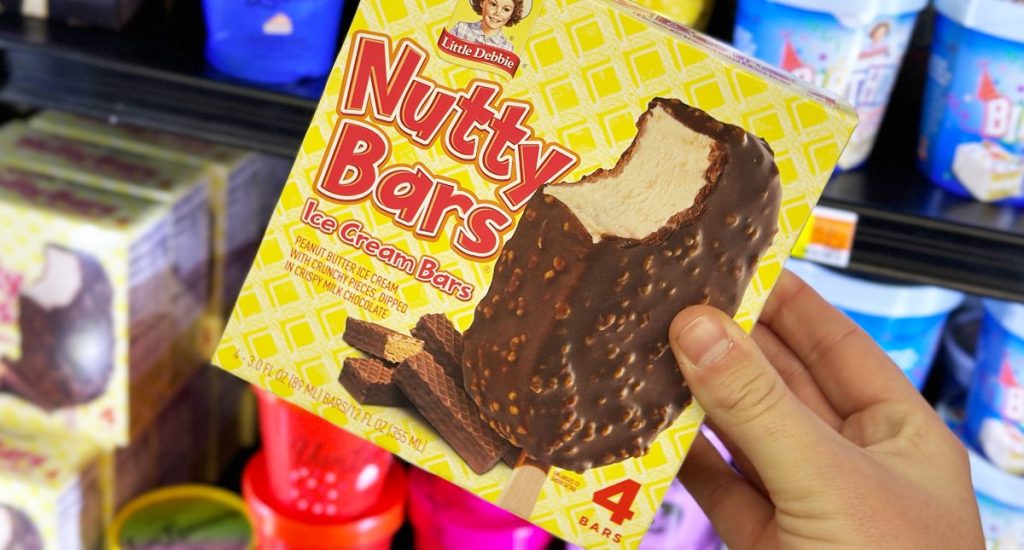 Nutty Buddy Ice Cream Bars box being held in front of the ice cream shelves