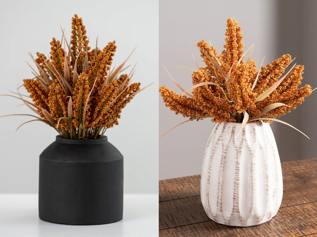 orange wheat in black vase and white vase