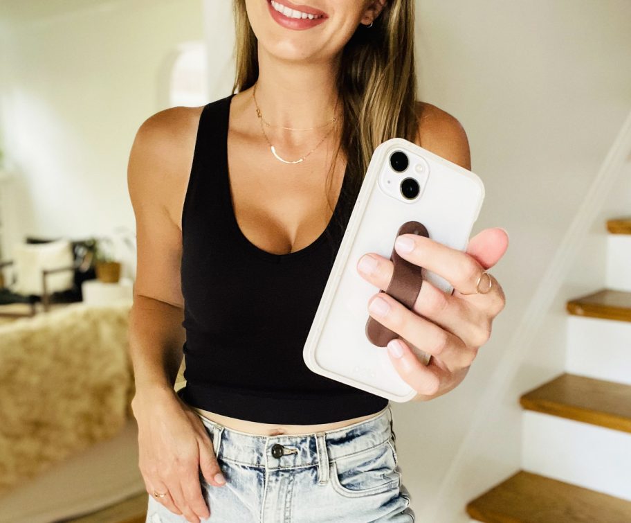 woman holding up iphone with clear case