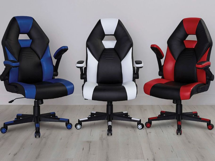 3 gaming chairs in blue, white, & red