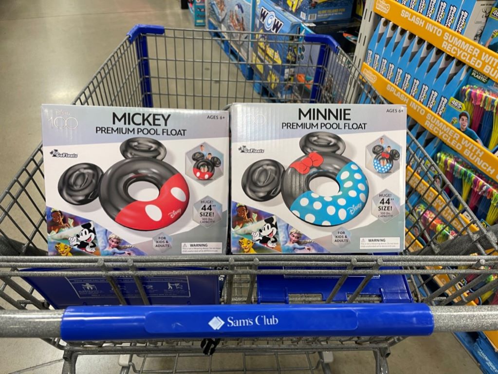 Two Disney pool floats in a cart
