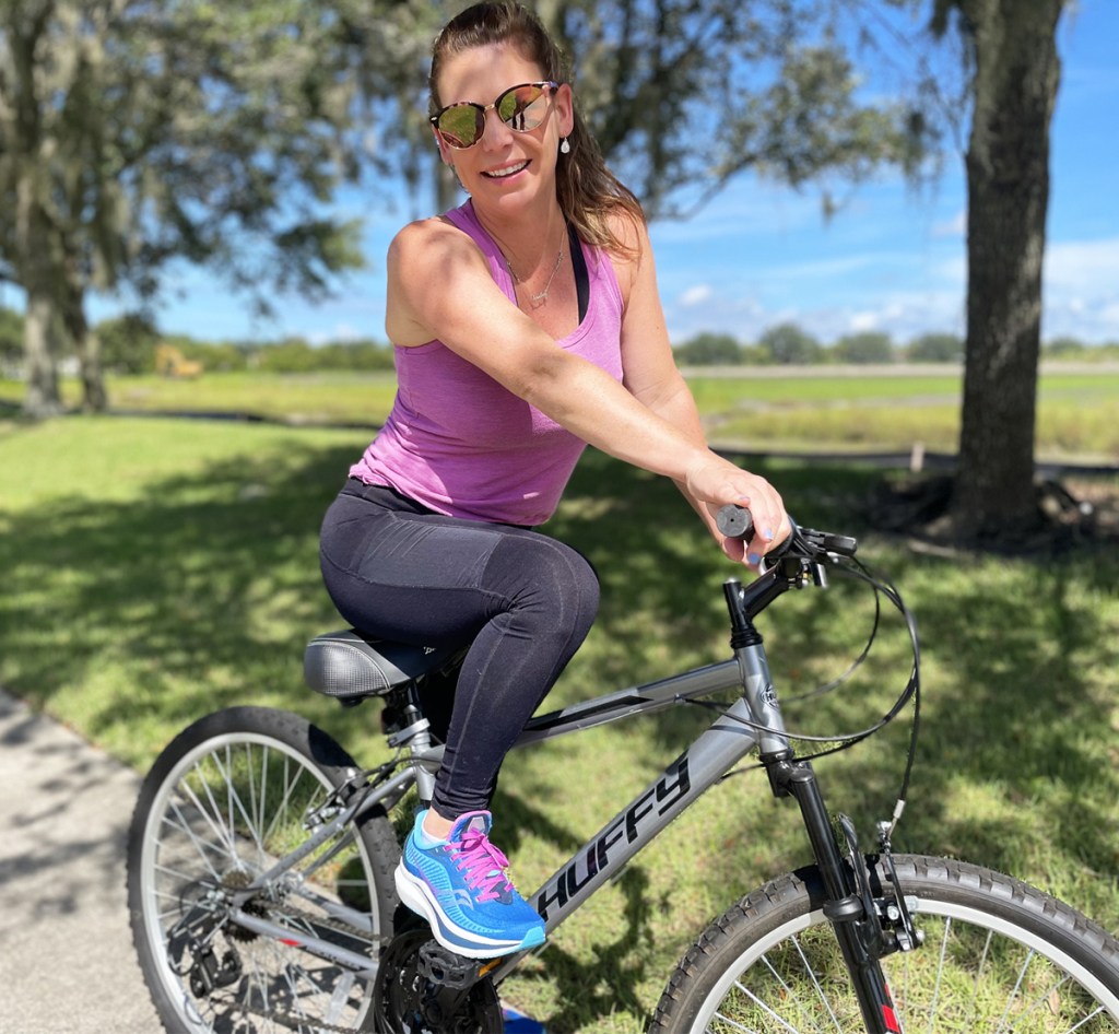 woman riding bike in park