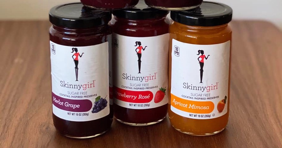 three jars of Skinnygirl Preserves on wood table