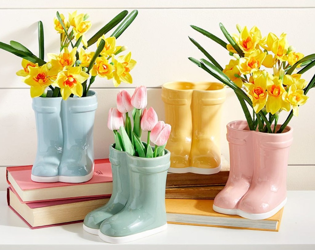 Ceramic vases that look like a pair of boots with flowers in them