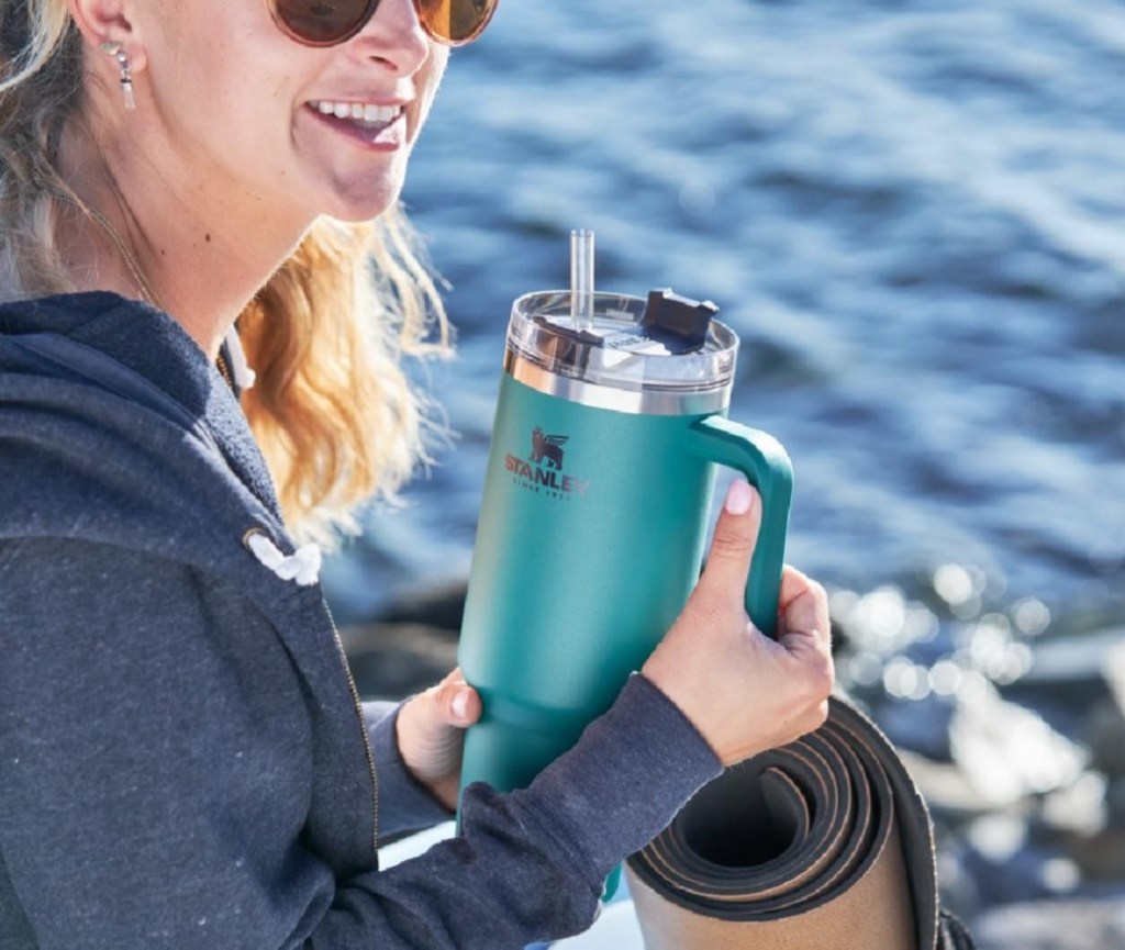 woman holding a Stanley Tumbler