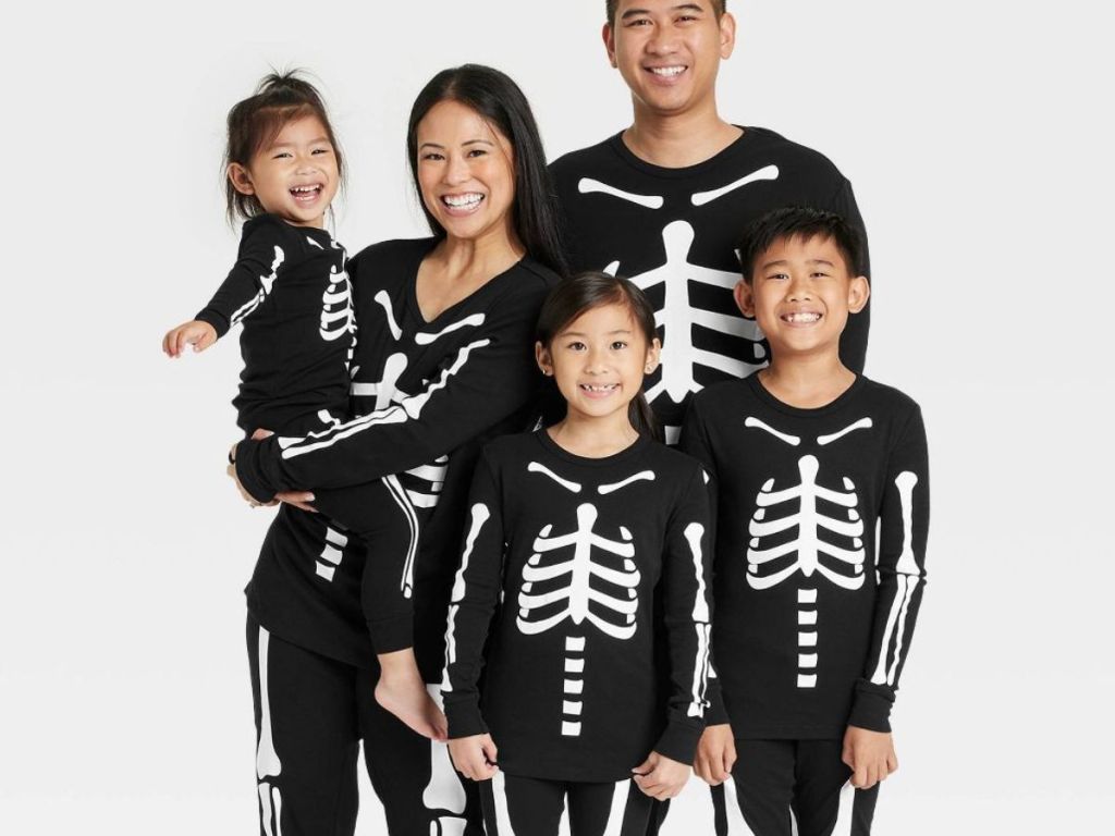 family wearing Target Skeleton Halloween Pajamas