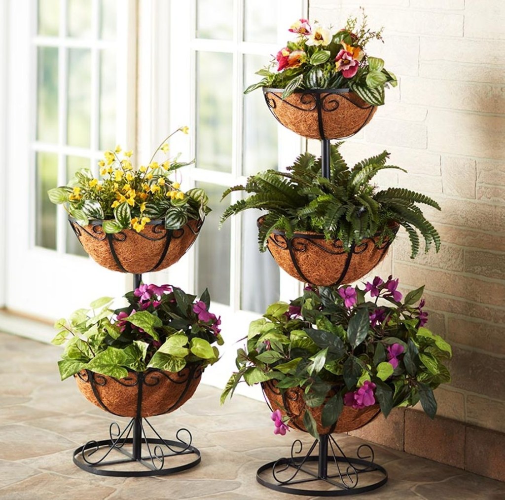 Two planters with coco liners and plants in them