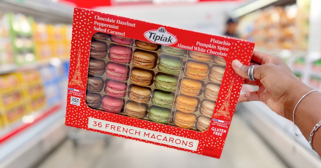 hand holding large pack of macarons