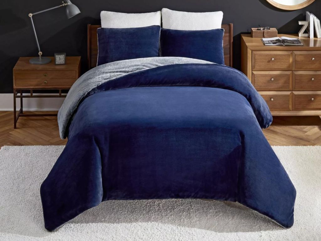 navy comforter on bed