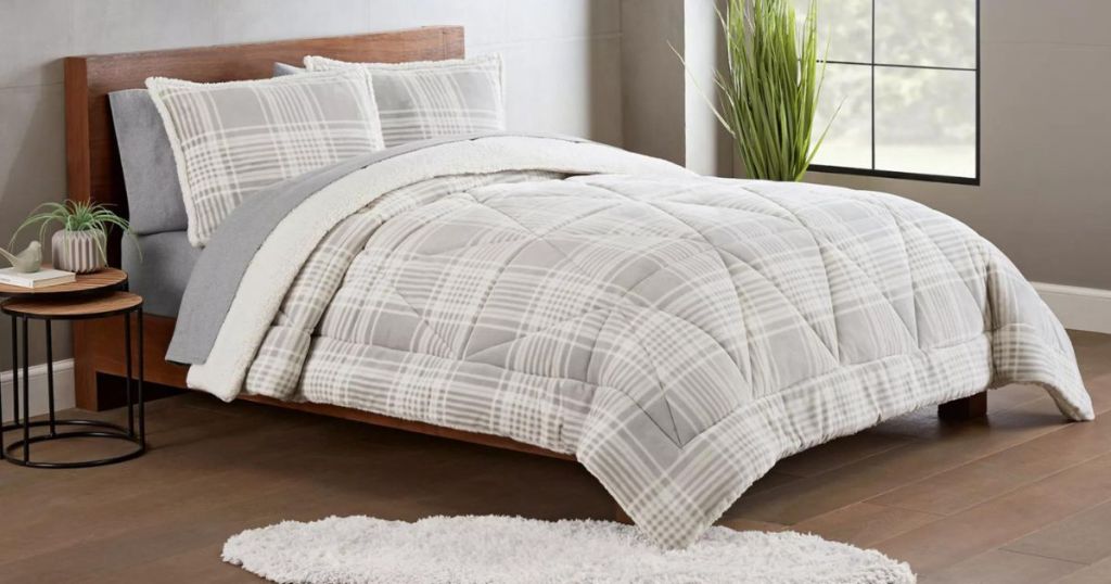 gray and white plaid comforter on bed