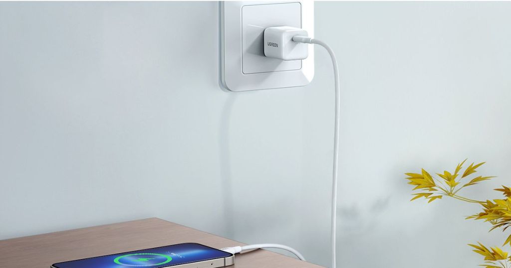 UGREEN white charger plugged into outlet