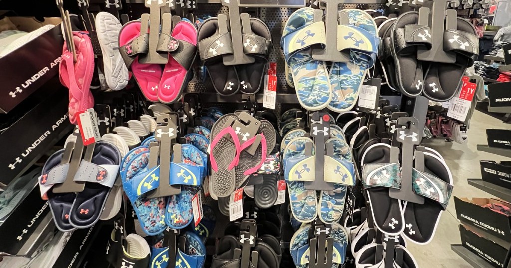 display of under armour sandals and slides in store