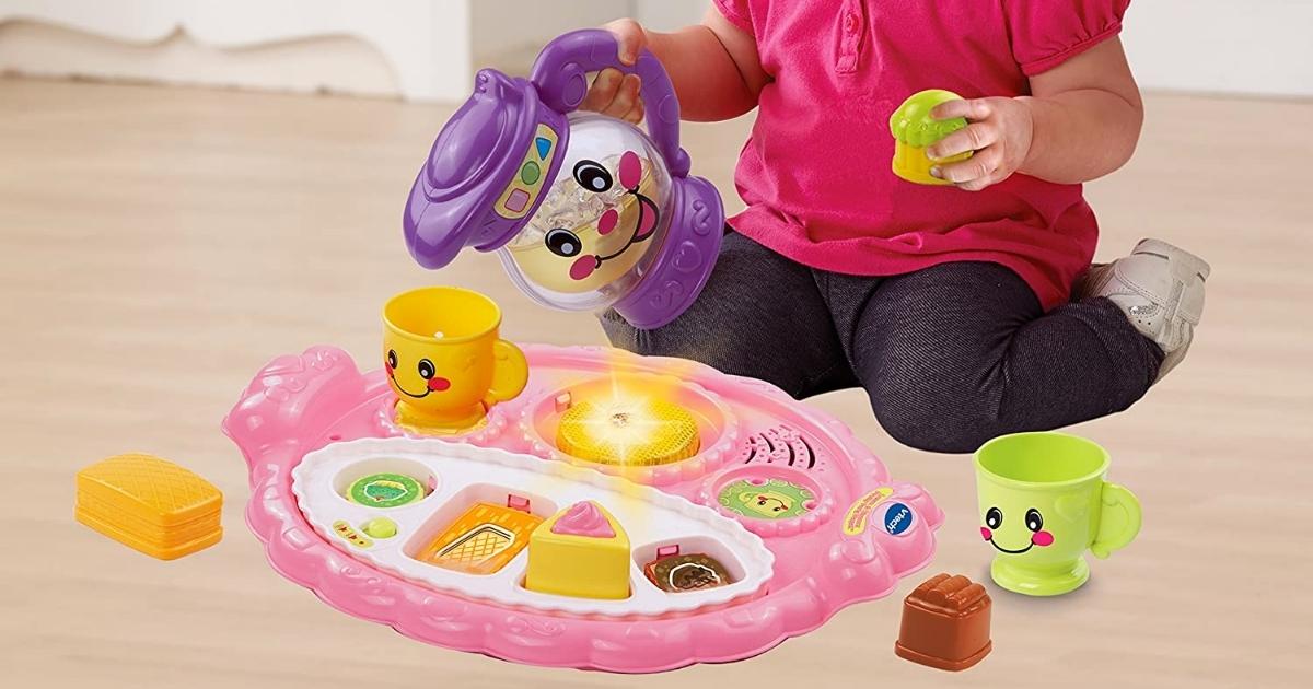 young girl playing with a VTech Learn and Discover Pretty Party Playset