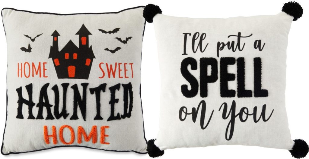 two white and black Halloween pillows