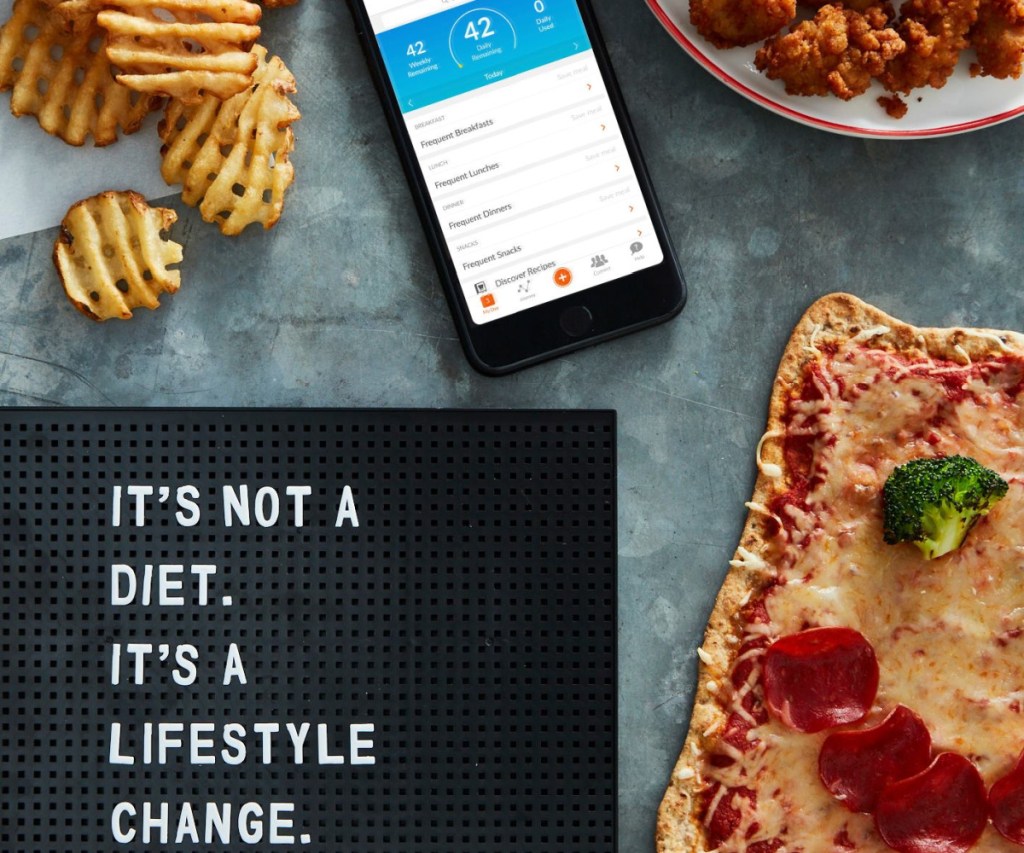 WeightWatchers app on phone and food on counter