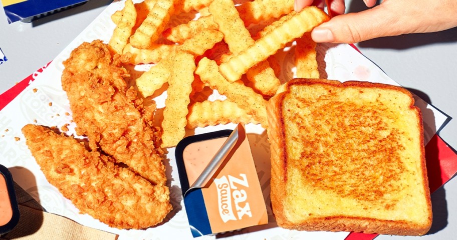 taking a french fry from a Zaxby's meal