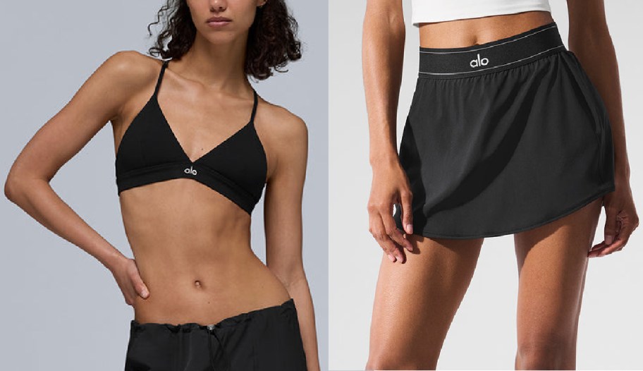 Two women model black athletic wear by Alo, featuring a bikini-style sports top and a wrap skirt.