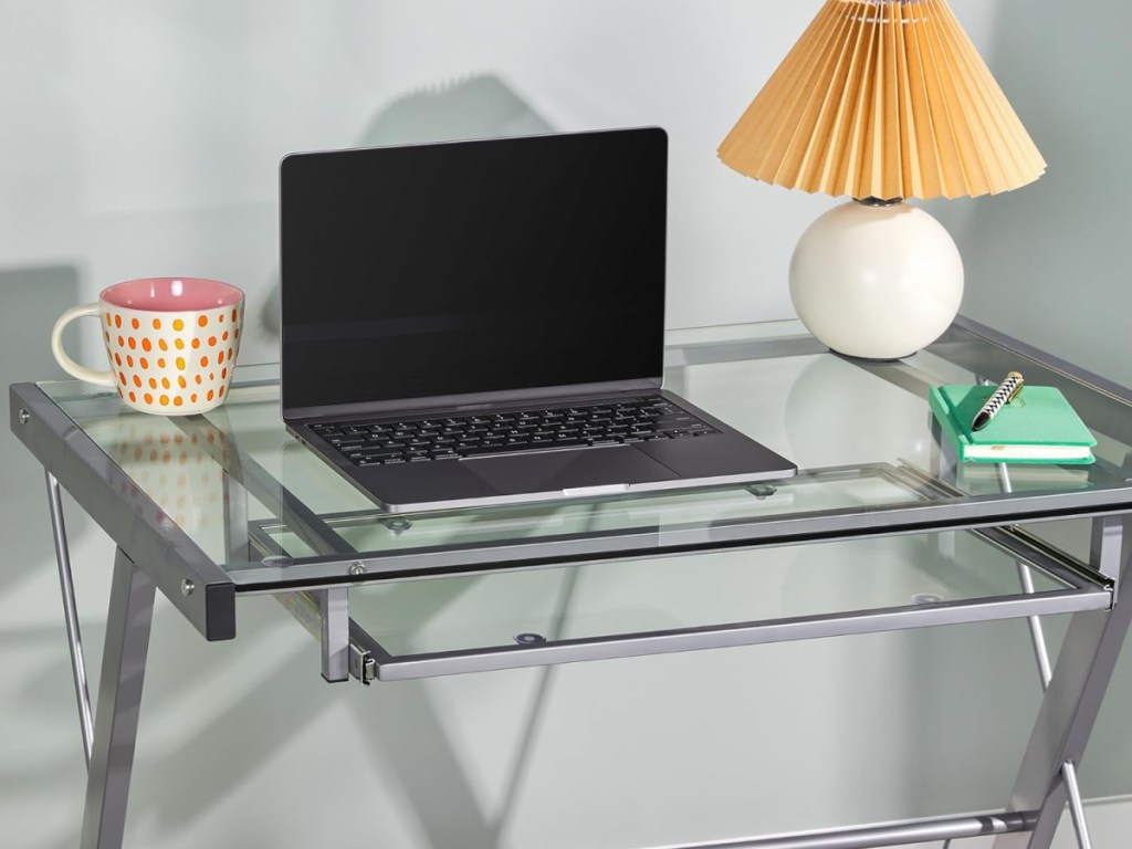 desk with laptop and items on it