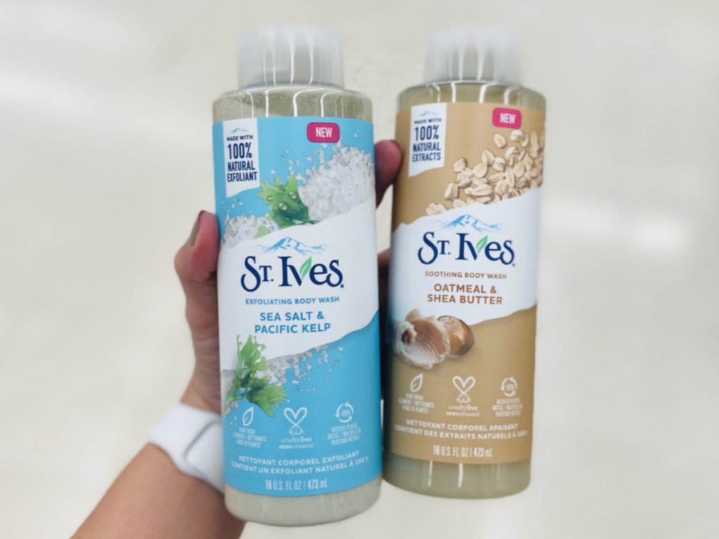 hand holding two St. Ives body washes