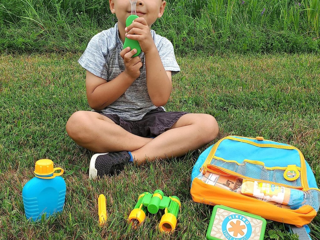 kids playing with outdoor explore kit