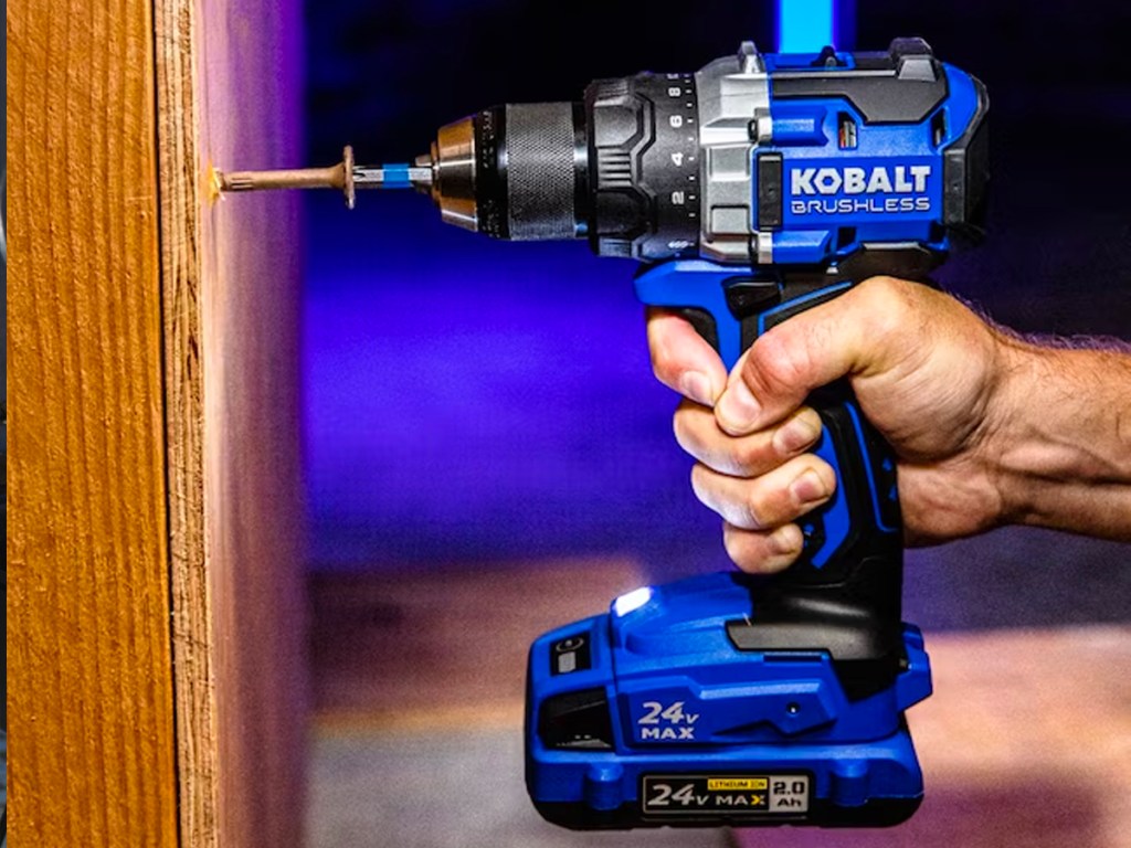 kobalt drill being used by a hand