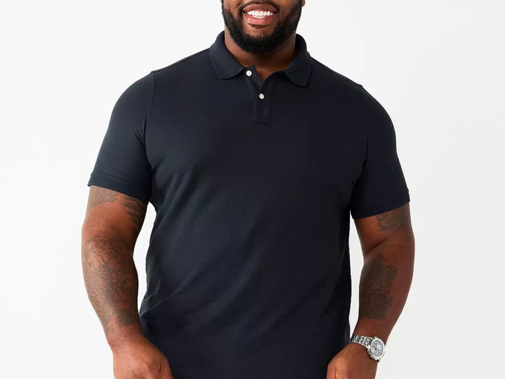 man wearing black polo shirt