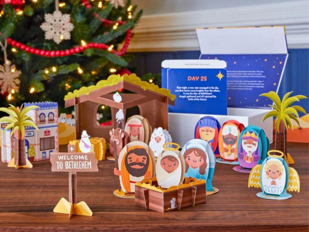 Lovepop Nativity Advent Calendar and accessories on wood table