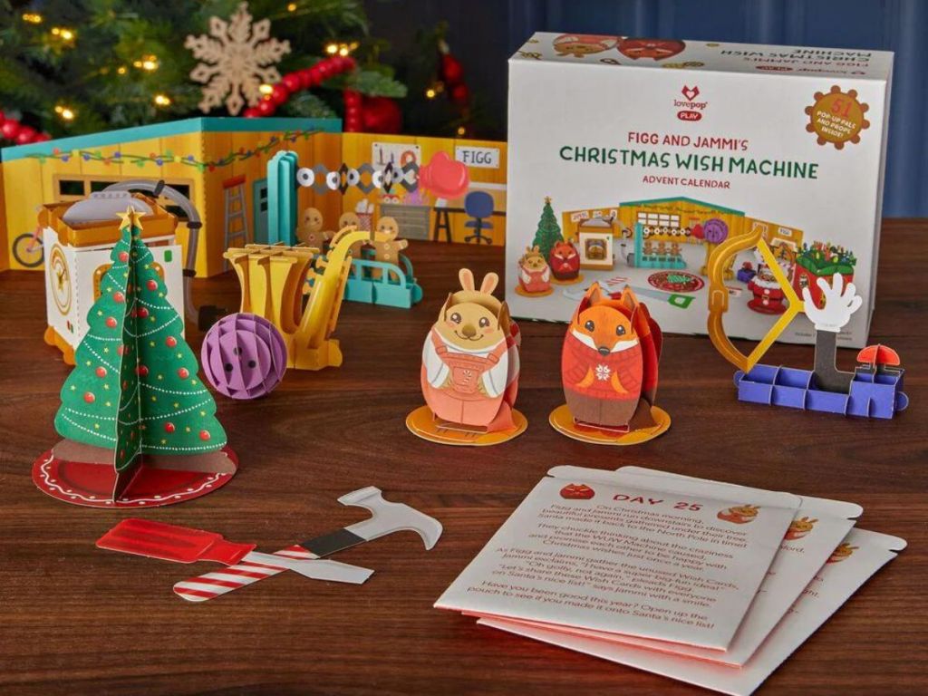 Lovepop Figg and Jammi's Christmas Wish Machine Advent Calendar and accessories on wood table