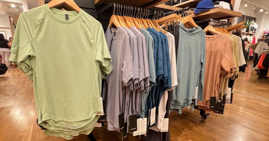 Display of men's shirts on hangers at a lululemon store