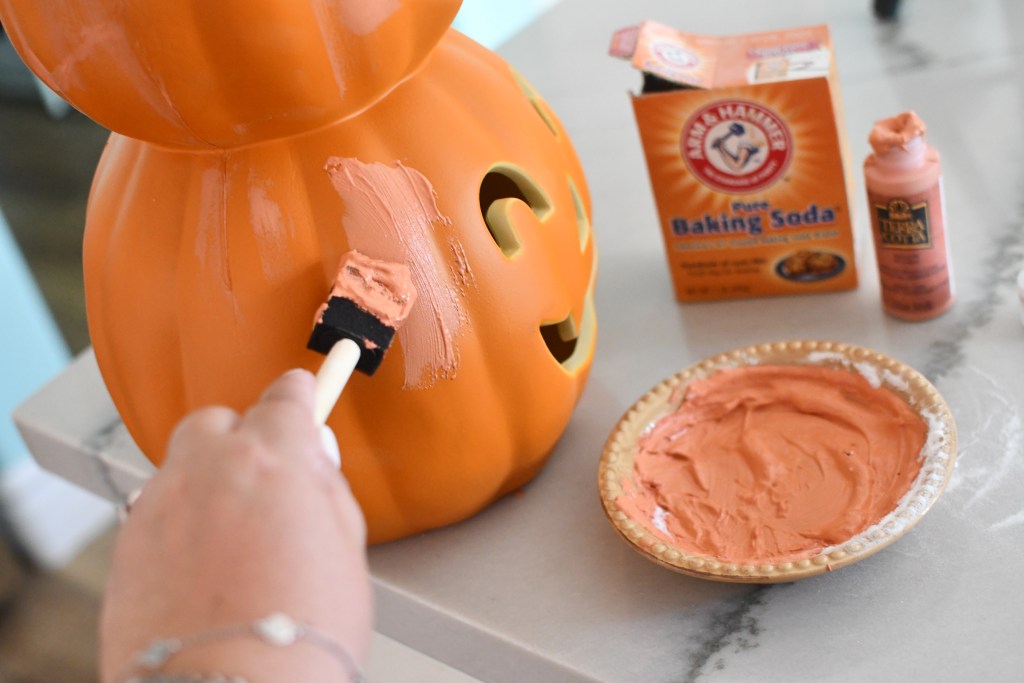 painting pumpkin with terracotta paint