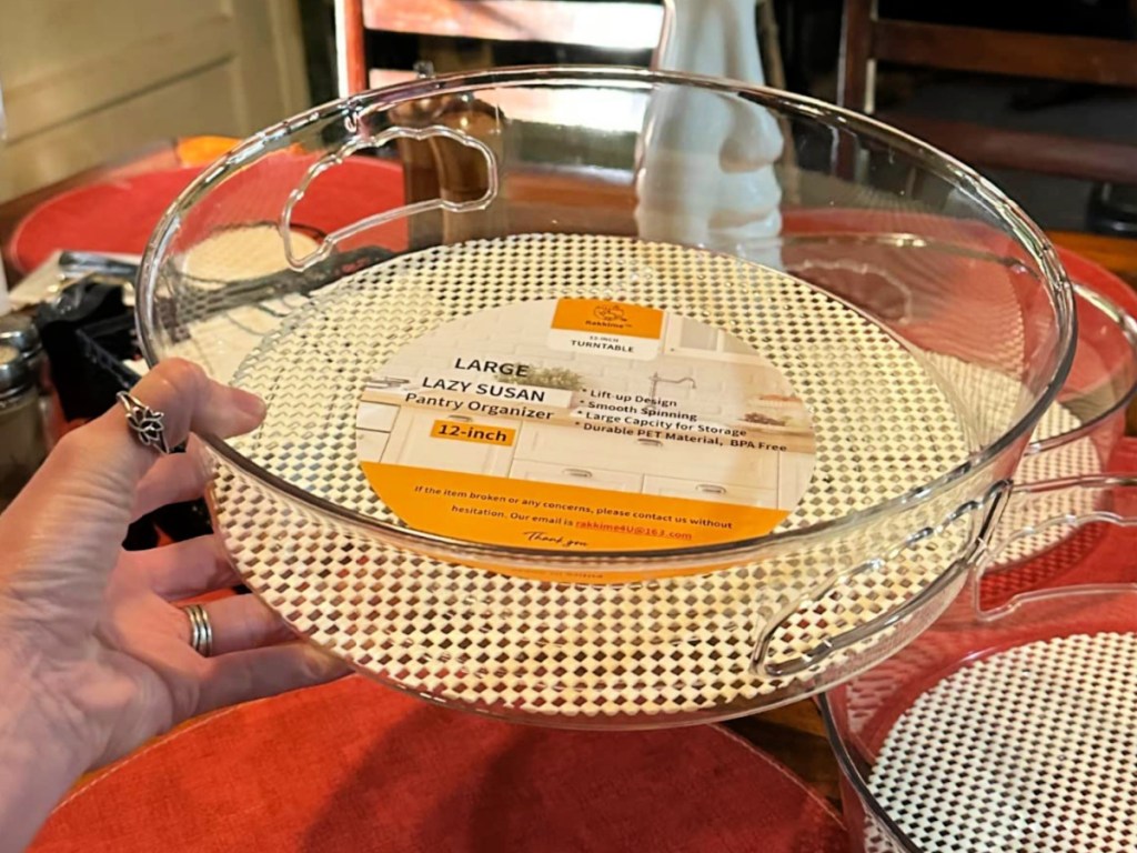 person holding up Lazy Susan with non skid liner