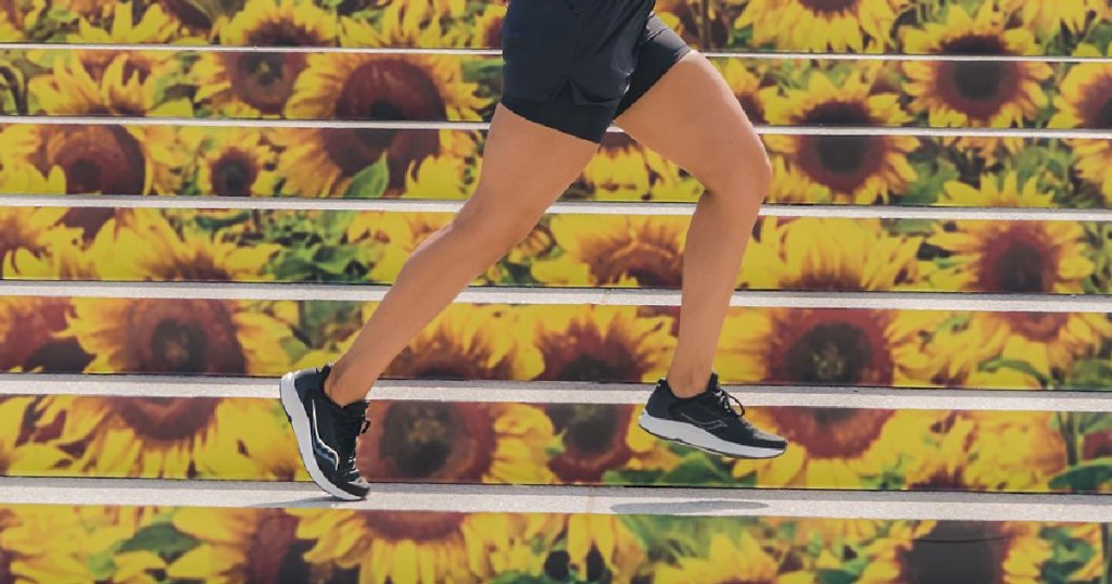 woman running on sunflower print stairs