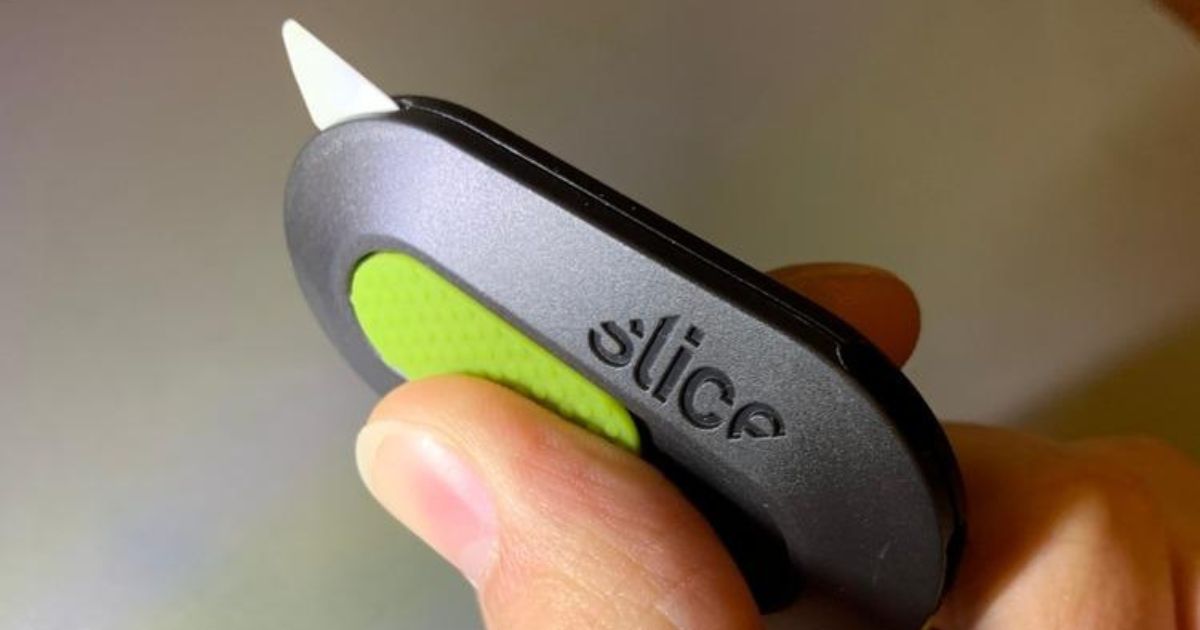 hand holding Slice box cutter