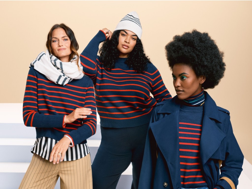 3 women wearing striped sweaters