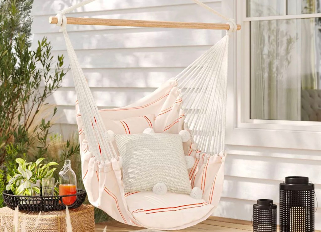 white with red striped hanging hammock on front porch