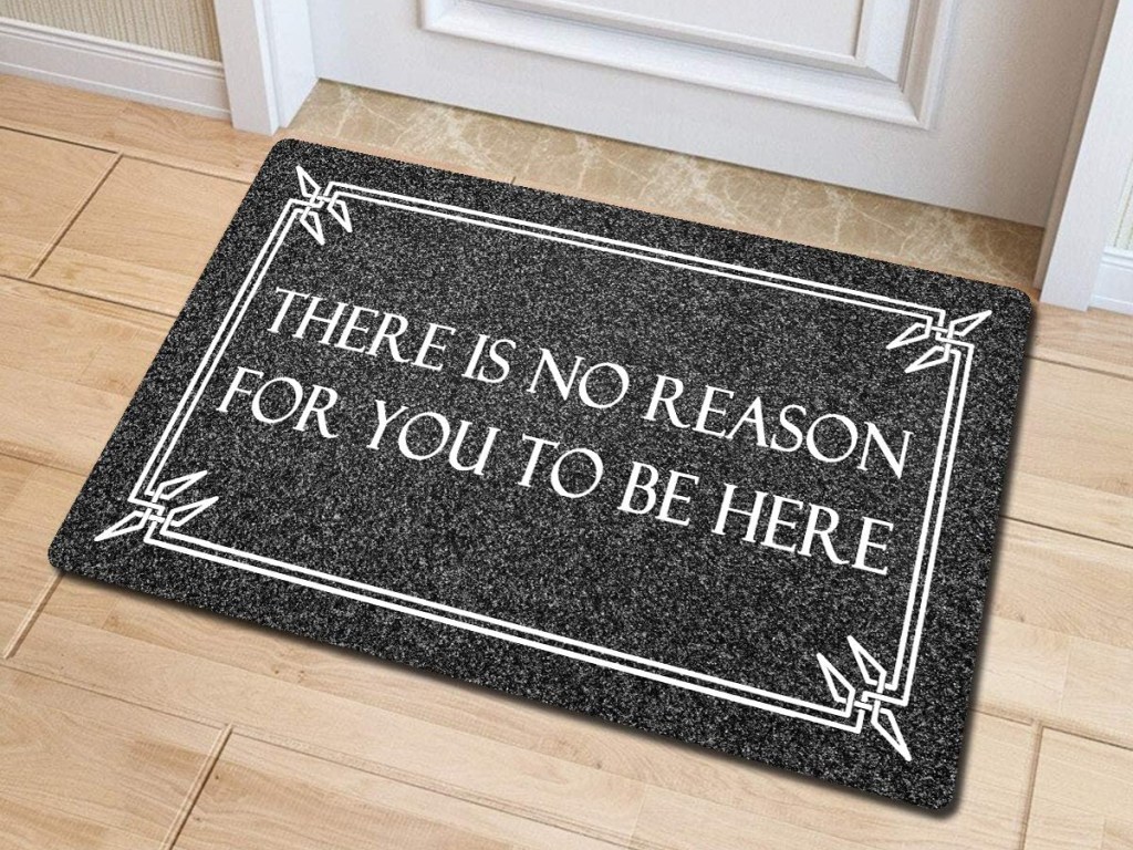 Doormat reading "There is no reason for you to be here."