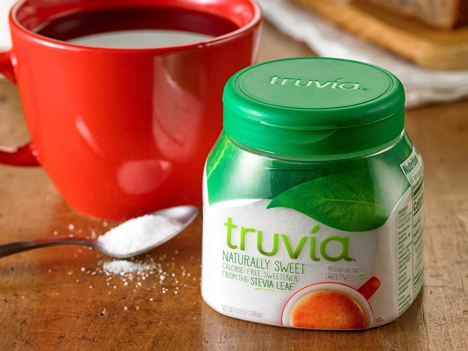 spoonable Truvia next to a red mug