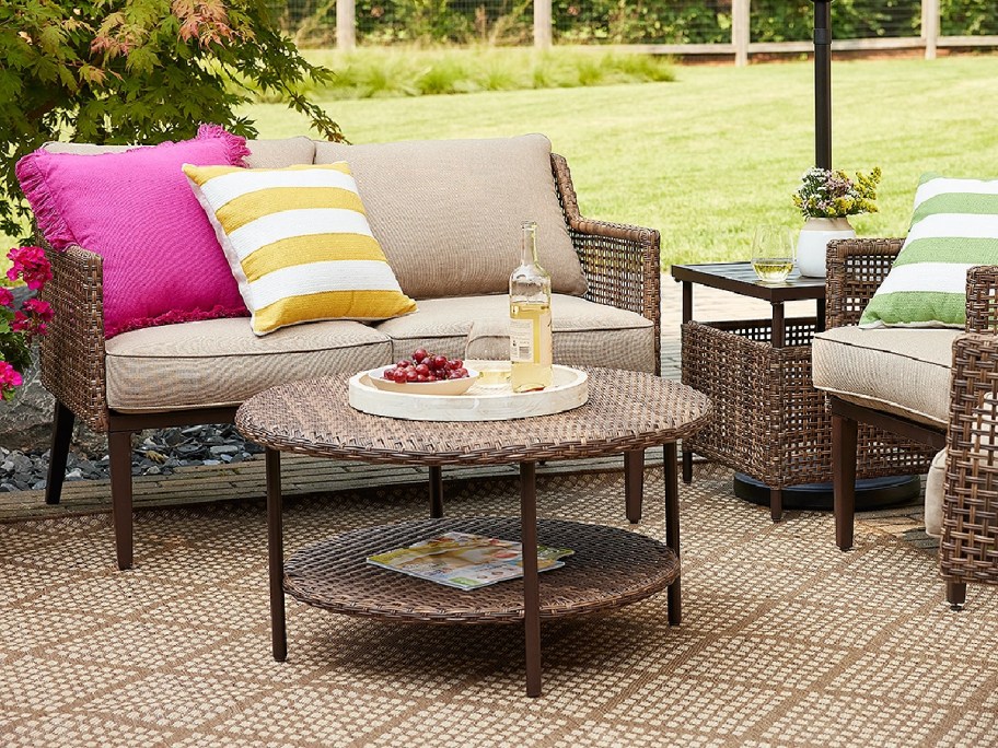wicker table displayed next to couches outside