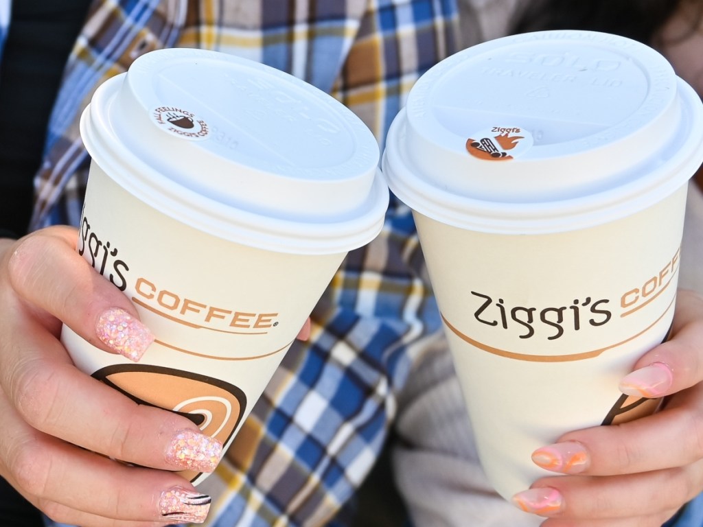 two hands holding coffee
