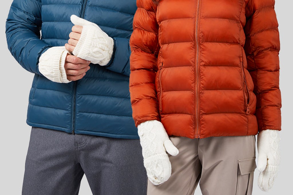 people in blue and orange puffer jackets and white flip-top mittens