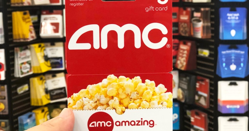 hand holding an AMC Gift Card