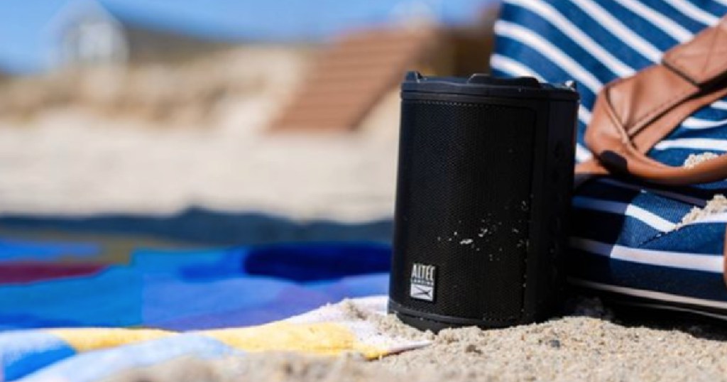 black speaker on beach 