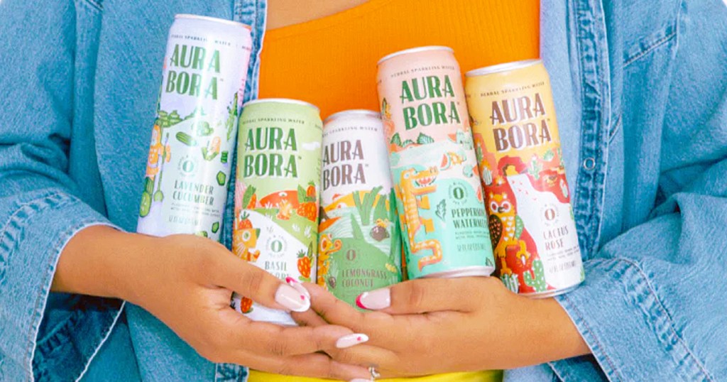 hands holding cans of Aura Bora Sparkling Water