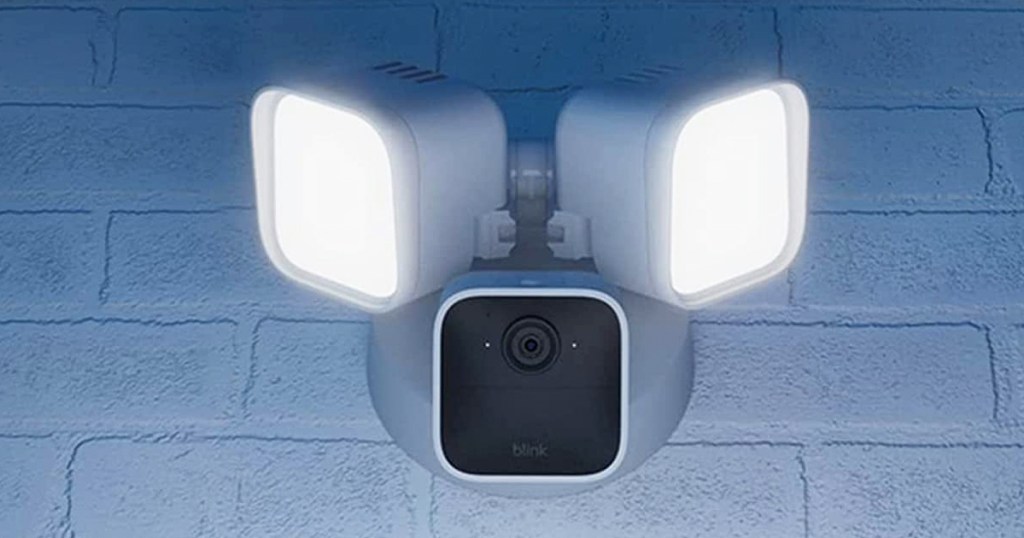 blink floodlight camera attached to white brick