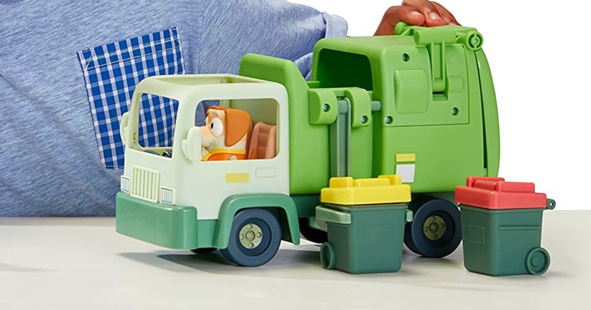 child playing with the Bluey Garbage Truck set