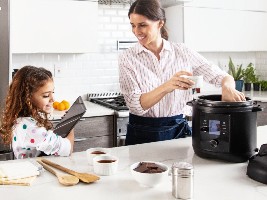 mom and daughter cooking with pressure cooker