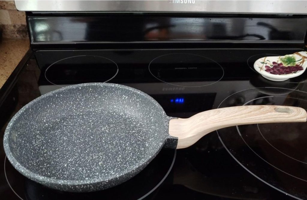 Carote 8" Grabite frying pan on stove with ceramic top